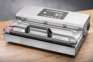 Avid Armor 100 Vacuum Sealer System on a light wooden table top.