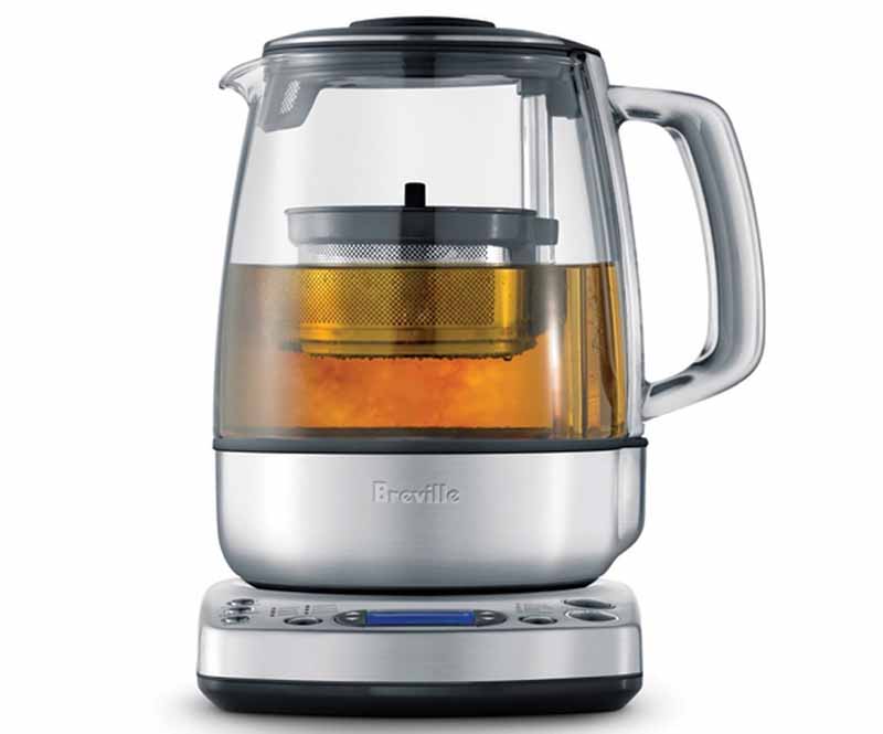 Square image of a silver kettle with tea.