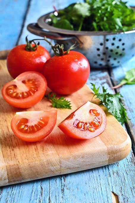 Colander with Salad Greens and Tomatoes | Foodal.com