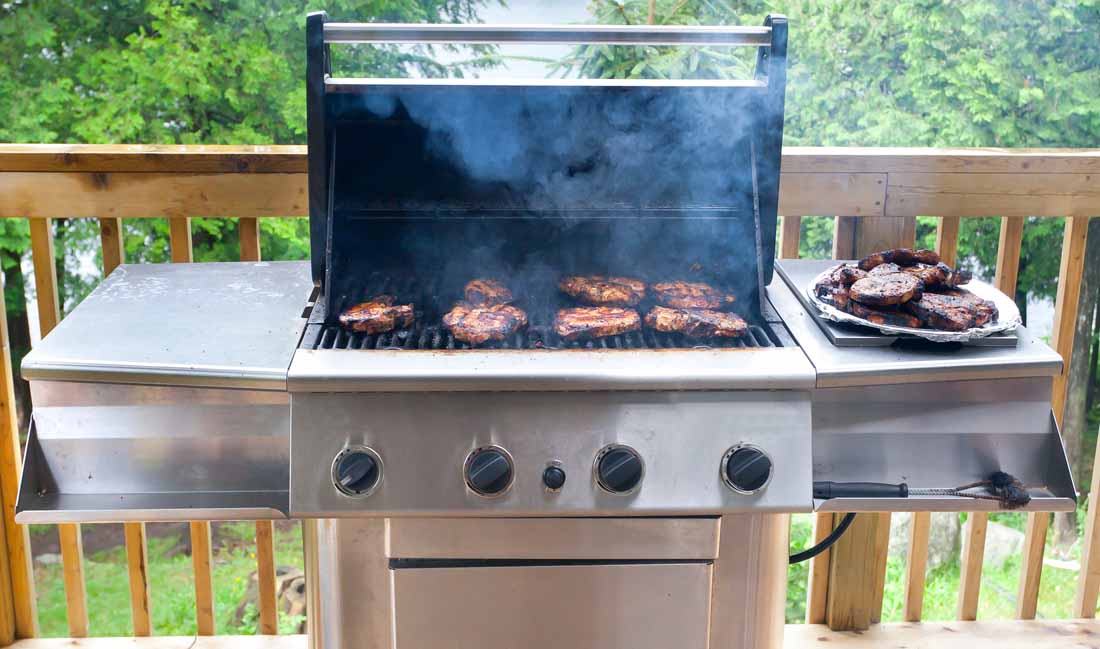 Gas grill on a deck | Foodal.com