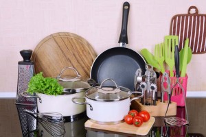 A bunch of kitchen tools laid out on a countetop