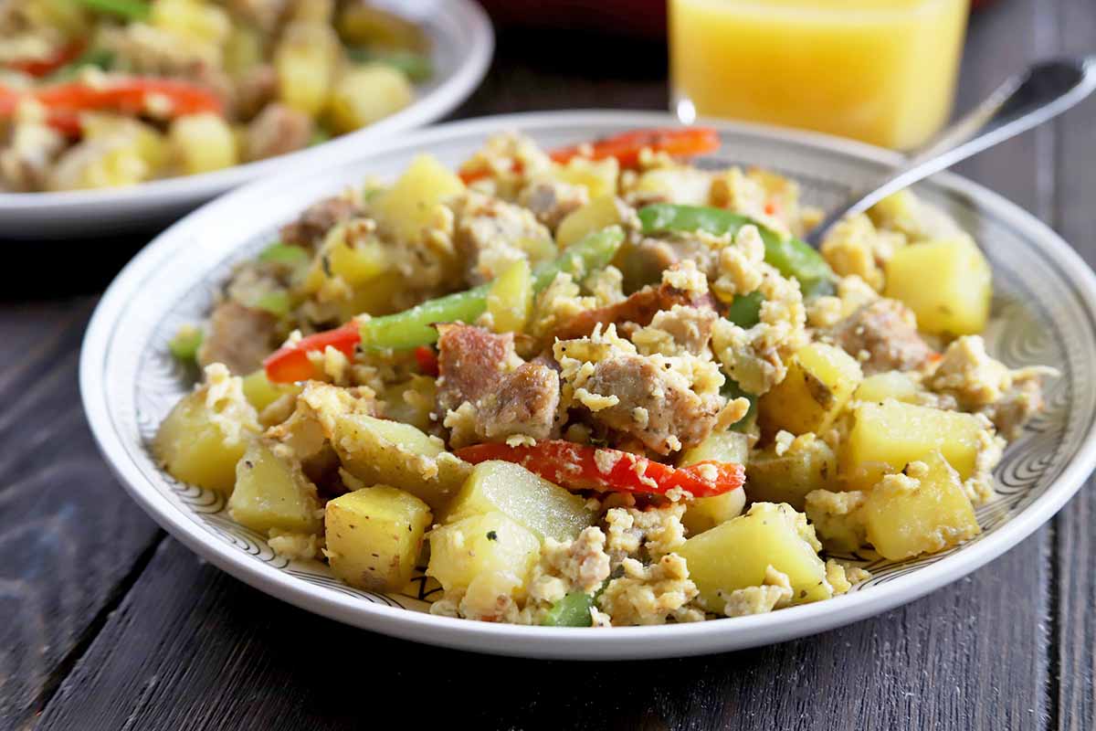 Horizontal image of a plateful of a savory breakfast heap.